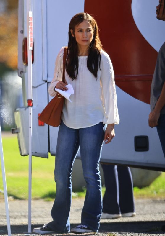 Jennifer Lopez in a Cream Blouse and Denim - "Unstoppable" Set at a Park in Downtown LA 12/15/2023