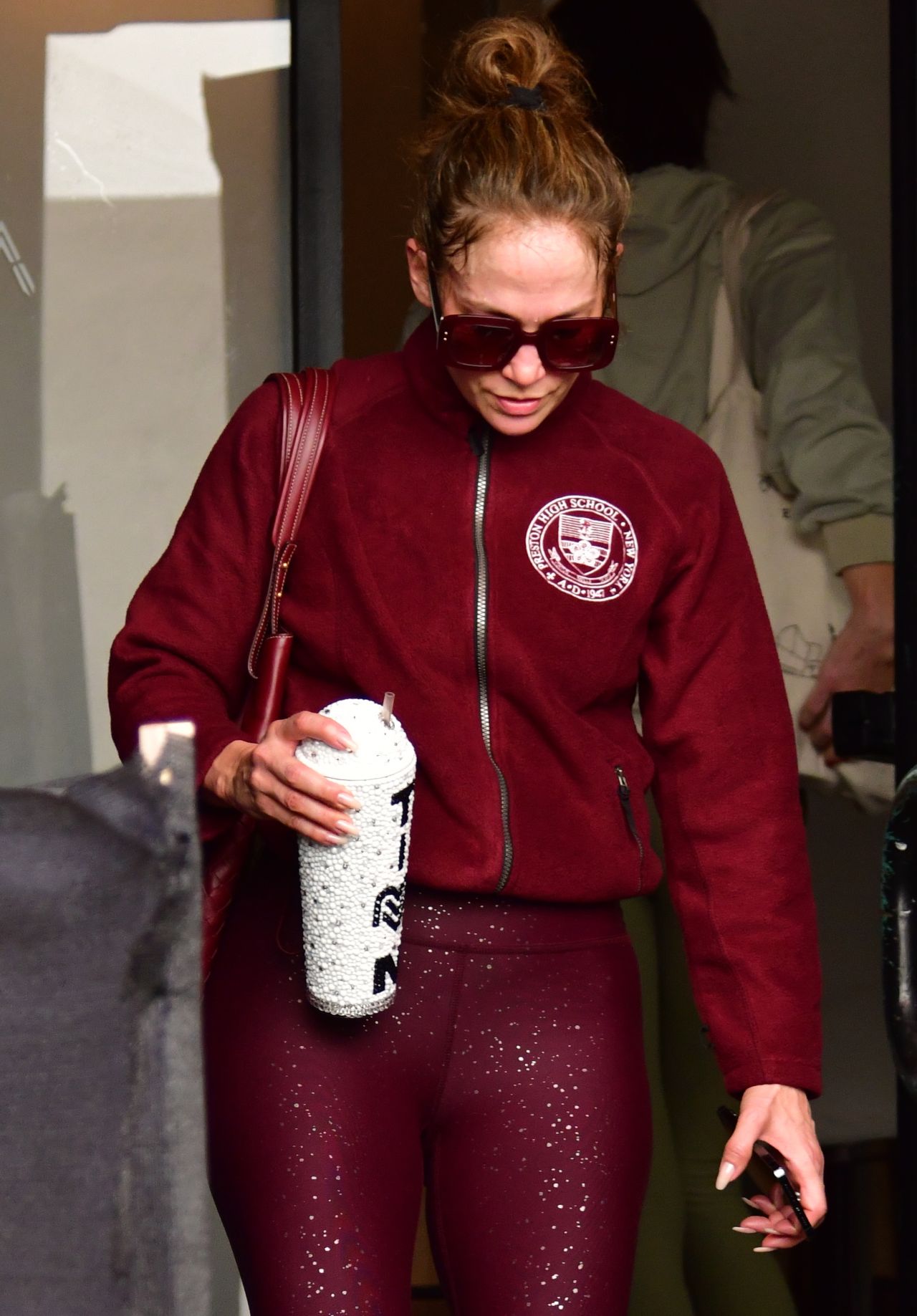 Jennifer Lopez in Maroon Jacket Paired With a Matching Bag, Ombré