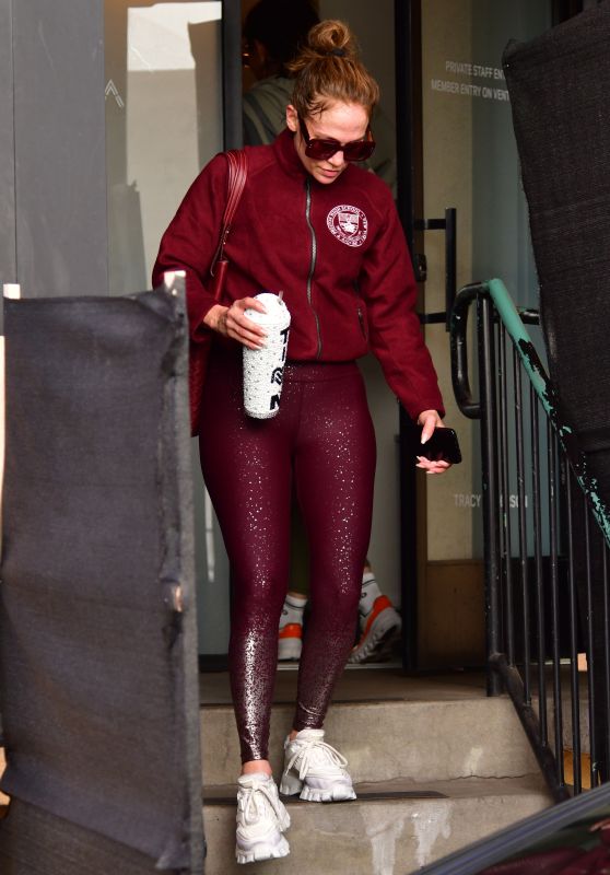 Jennifer Lopez in Maroon Jacket Paired With a Matching Bag, Ombré Sparkly Leggings and White Prada Sneakers in Studio City 12/05/2023