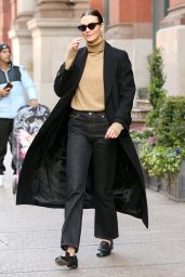 Karlie Kloss in a Tan Turtleneck, Black Jeans and Black Overcoat in NYC 12/08/2023