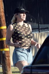 Kesha Wearing a Sheer Top and Distressed Denim Jean in Los Angeles 12/14/2023
