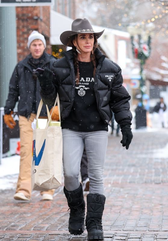 Kyle Richards in a Black Prada Jacket Paired With Matching Prada Sweater and Boots in Aspen 12/24/2023