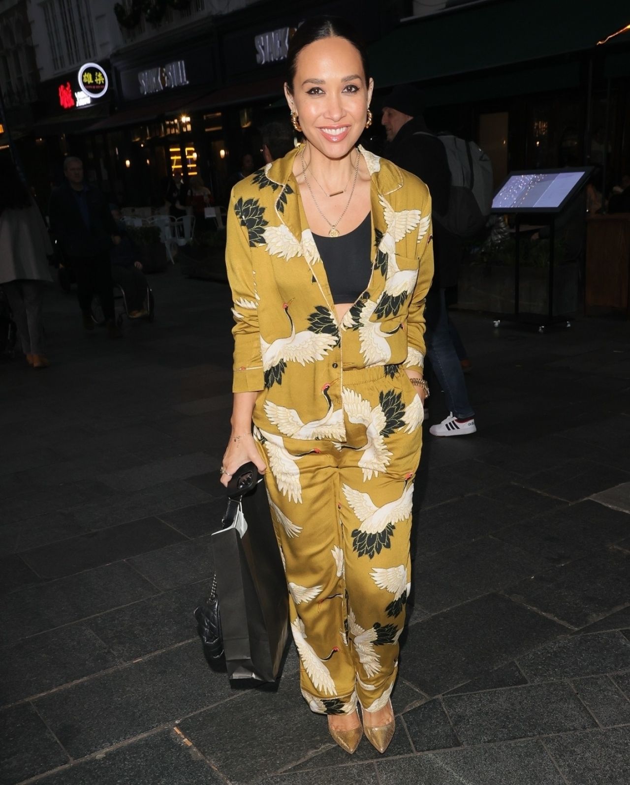 Myleene Klass Wearing a Crop Top Beneath a Bright Jumpsuit at Smooth