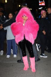 Nicki Minaj in Bright Pink Fur Coat, Black Latex Leggings and Matching Fur Boots in New York 12/11/2023