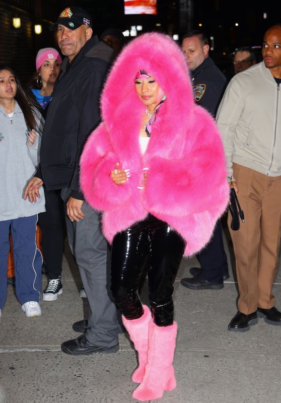 Nicki Minaj in Bright Pink Fur Coat, Black Latex Leggings and Matching Fur Boots in New York 12/11/2023