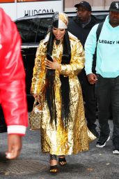 Nicki Minaj Wearing a Golden Dress and Golden Handbag in NYC 12/11/2023
