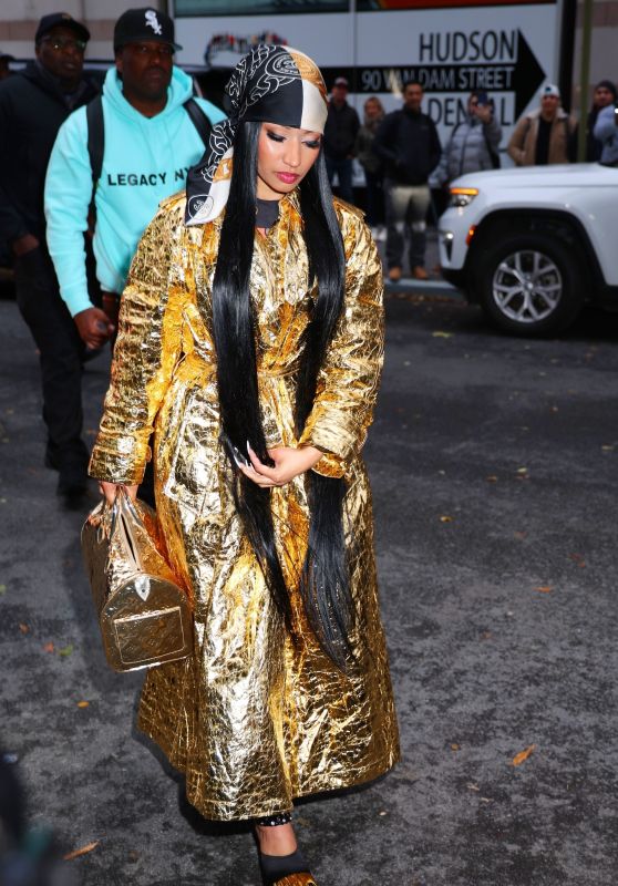 Nicki Minaj Wearing a Golden Dress and Golden Handbag in NYC 12/11/2023