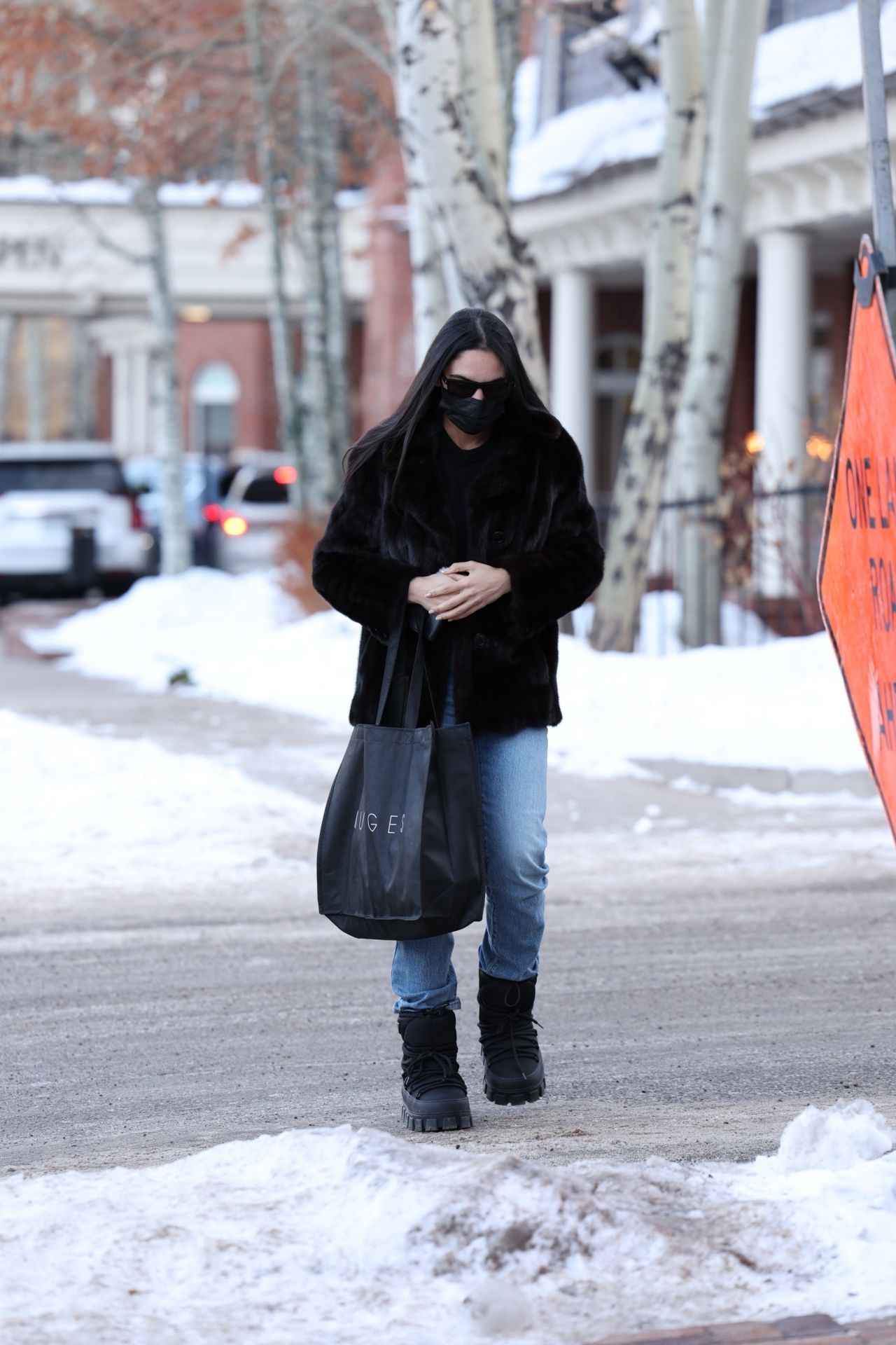 Noor Alfallah in a Fur Jacket, Jeans and Prada Boots - Shopping in