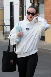 Olivia Wilde in Cream Hoodie, Black Leggings and Sunglasses in Los Angeles 12/11/2023