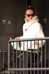 Olivia Wilde in Cream Hoodie, Black Leggings and Sunglasses in Los Angeles 12/11/2023
