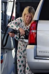 Tori Spelling in a Snoopy-themed Christmas Onesie - Pumping Gas in Woodland Hills 12/15/2023