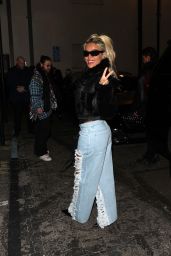 Karol G in a Corset Black Top, Ripped Jeans and an Aviator Leather Jacket 01/11/2024