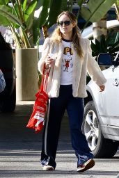 Olivia Wilde in Sneakers, Track Pants, and a Fuzzy Jacket at the Sephora Cosmetics Store in Studio City 12/30/2023
