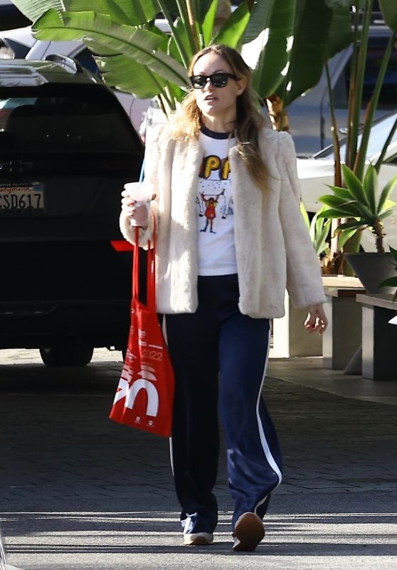 Olivia Wilde in Sneakers, Track Pants, and a Fuzzy Jacket at the Sephora Cosmetics Store in Studio City 12/30/2023