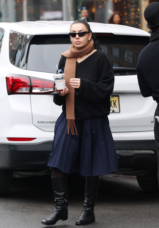 Charli XCX in a Black Sweater and a Navy Skirt in New York 02/23/2024
