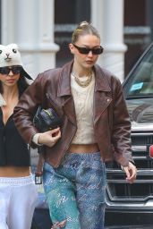 Gigi Hadid in a Brown Leather Jacket and Carrying a MIU MIU Black Bag in New York 02/27/2024