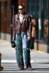 Gigi Hadid in a Brown Leather Jacket and Carrying a MIU MIU Black Bag in New York 02/27/2024