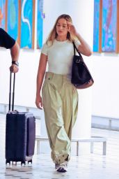Margot Robbie at Brisbane International Airport 02/03/2024