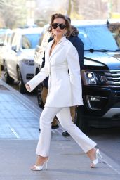 Rita Ora Wears a White Pant Suit and White Mules to The View in New York 02/16/2024