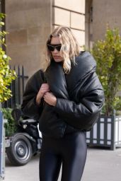 Stella Maxwell in a Black Catsuit and Oversize Puffer Jacket 02/27/2024