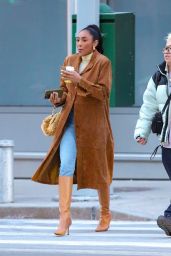 Tayshia Adams in a Light Brown Leather Jacket, Denim Jeans, White Top and Light Brown Leather Boots in New York 02/20/2024