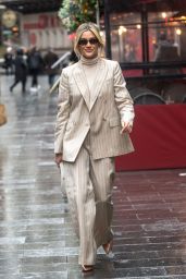 Ashley Roberts Wearing a Reiss Beige Pinstripe Suit and White Miu Miu Bag in London 02/29/2024