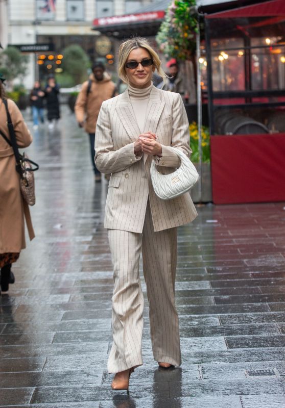 Ashley Roberts Wearing a Reiss Beige Pinstripe Suit and White Miu Miu Bag in London 02/29/2024