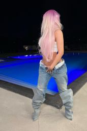 Cardi B in a White Top and Blue Jeans 03/25/2024