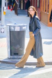 Emily Ratajkowski in a Black Leather Coat Paired With Light Brown Pants Running Errands in New York 03/04/2024