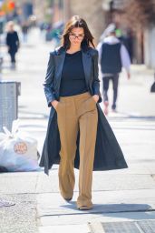 Emily Ratajkowski in a Black Leather Coat Paired With Light Brown Pants Running Errands in New York 03/04/2024