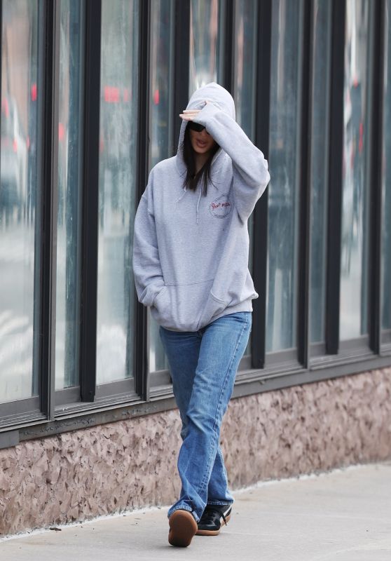 Emily Ratajkowski in a Gray Hoodie Paired With Jeans and Black Puma Sneakers in West Village 03/13/2024