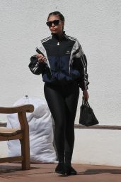 Lori Harvey in a Balenciaga Jacket and Black Leggings 03/25/2024