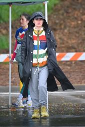 Rachel Bilson Wearing an Oversized Rain Coat and a Striped Sweater in Pasadena 03/23/2024