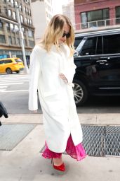 Sydney Sweeney in a White Coat, Pink Dress and Red Heels Leaves a Bai Event in New York 03/07/2024