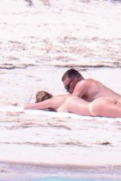 Taylor Swift in a Bikini at a Beach in The Bahamas 03/21/2024 (more photos)