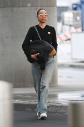 Zoe Saldana Arriving at JFK Airport in New York 03/27/2024