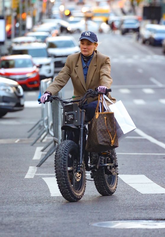Diane Kruger on Her Electric Bike in New York City 04-26-2024 • CelebMafia