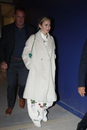 Emily Blunt in a Floral Print Ensemble Under Her Coat at Loulou in Paris 04-23-2024