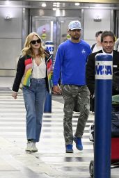 Heather Graham in a Colorful Coat Arrive to Miami International Airport 04-08-2024
