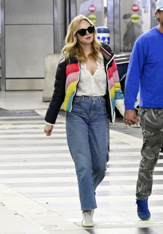 Heather Graham in a Colorful Coat Arrive to Miami International Airport 04-08-2024
