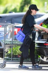 Kat Dennings in a Black Baseball Cap Paired With a Baggy Graphic Tee in Los Angeles 04-17-2024