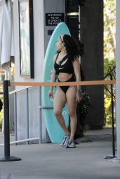 Keyshia Cole in a Black Bathing Suit, Dolce & Gabbana Sneakers and a Balenciaga Handbag 04-27-2024