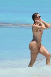 Khloe Kardashian in Metallic One-piece Swimsuit in the Turks and Caicos 04-03-2024