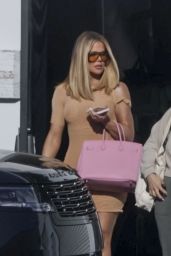 Khloe Kardashian Wearing a Short, Fitted Beige Dress in Los Angeles 04-12-2024