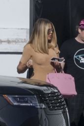 Khloe Kardashian Wearing a Short, Fitted Beige Dress in Los Angeles 04-12-2024
