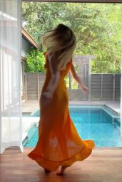 Michelle Monaghan in an Orange Dress 04-27-2024