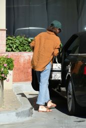 Sarah Hyland in an Orange Corduroy Jacket and Blue Jeans in Los Angeles 04-11-2024