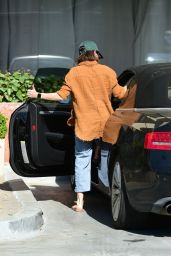 Sarah Hyland in an Orange Corduroy Jacket and Blue Jeans in Los Angeles 04-11-2024