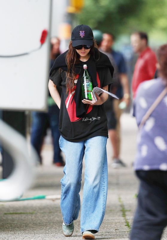 Dakota Johnson Wears a Rolling Stones Graphic T-shirt and Bell-bottom Jeans in Brooklyn 05-30-2024