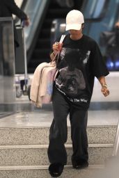 Karrueche Tran in an oversized Andre 3000 T-shirt in Los Angeles 04-30-2024